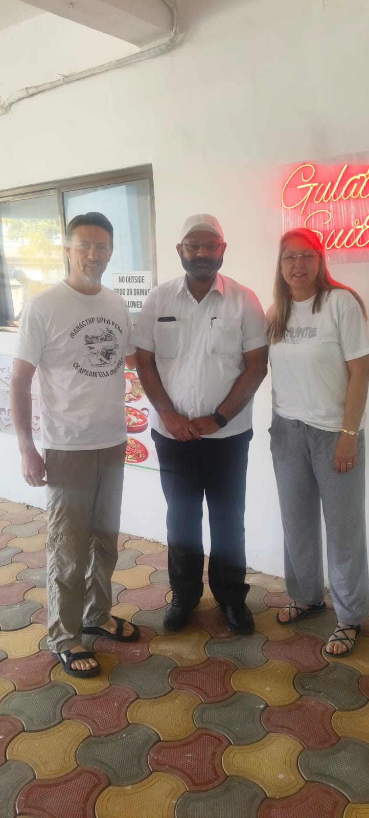 Happy guests with the Hotel Gulati Suites team